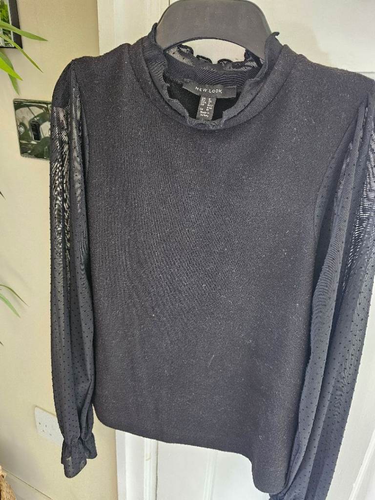 Beautiful New Look top with lace polka dot arms, size 8.