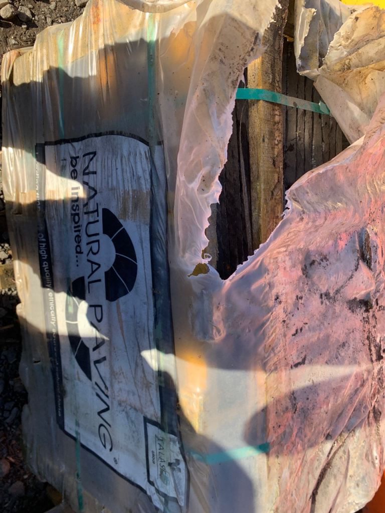 Pallets of grey Indian sandstone slabs