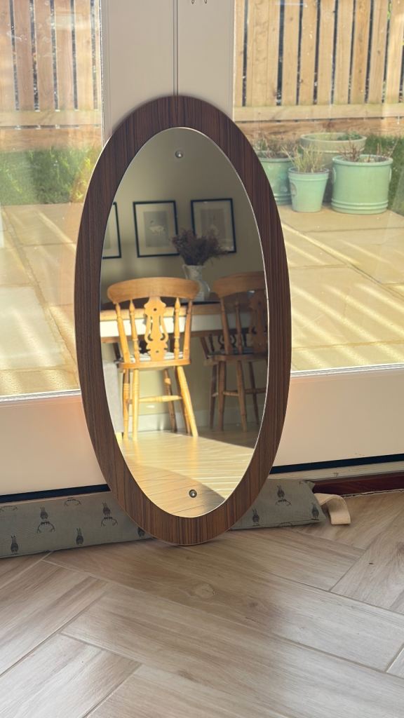 Vintage oval teak mirror