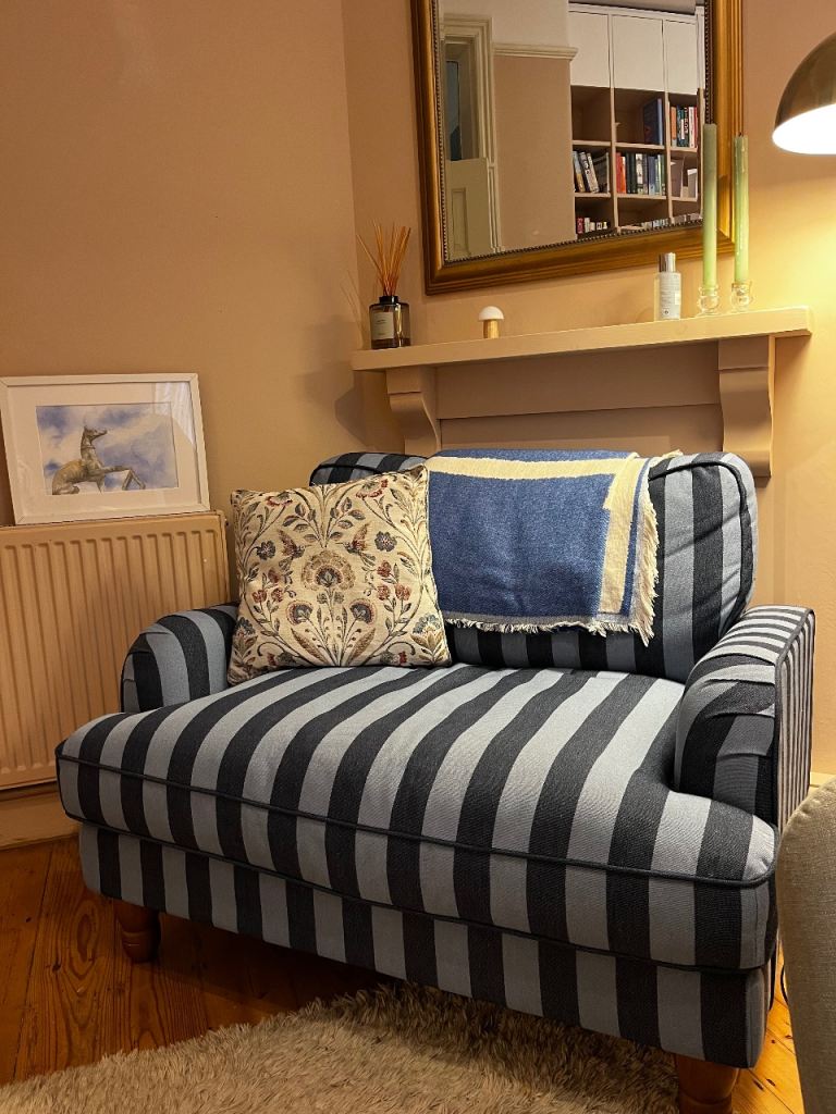 Blue striped loveseat armchair