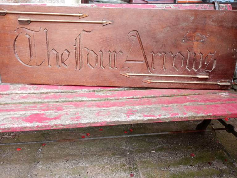Solid wood sign, engraved The Four Arrows, 4 brass arrows attached, 30.5cm x 94.5cm, Porthtowan