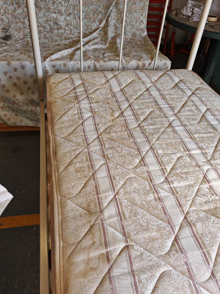White single metal bed with sprung mattress 