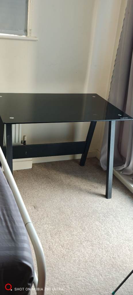 Black tempered glass work desk.