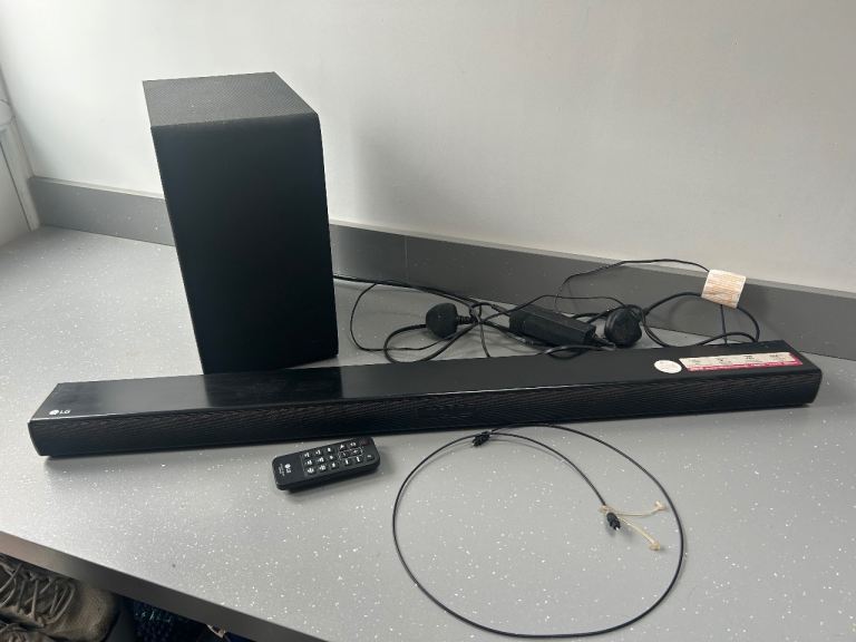 LG Soundbar and Subwoofer with Remote – Good Condition