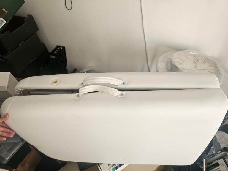 Massage table with paper rolls