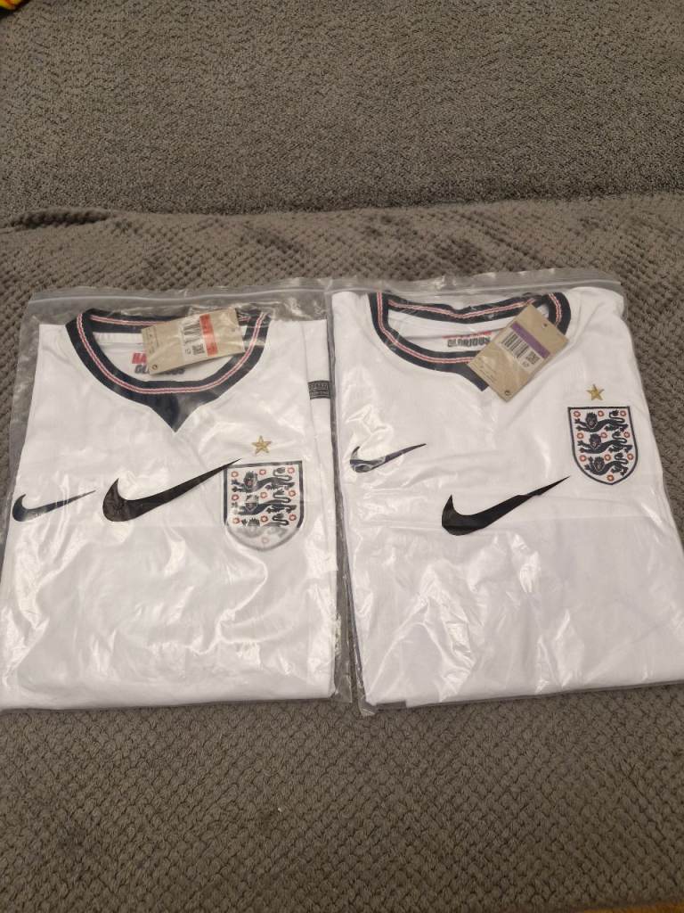 New Nike England Football Shirts (x2) – White 1 size large and 1 XXL