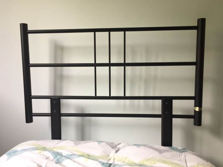 Single black metal headboard