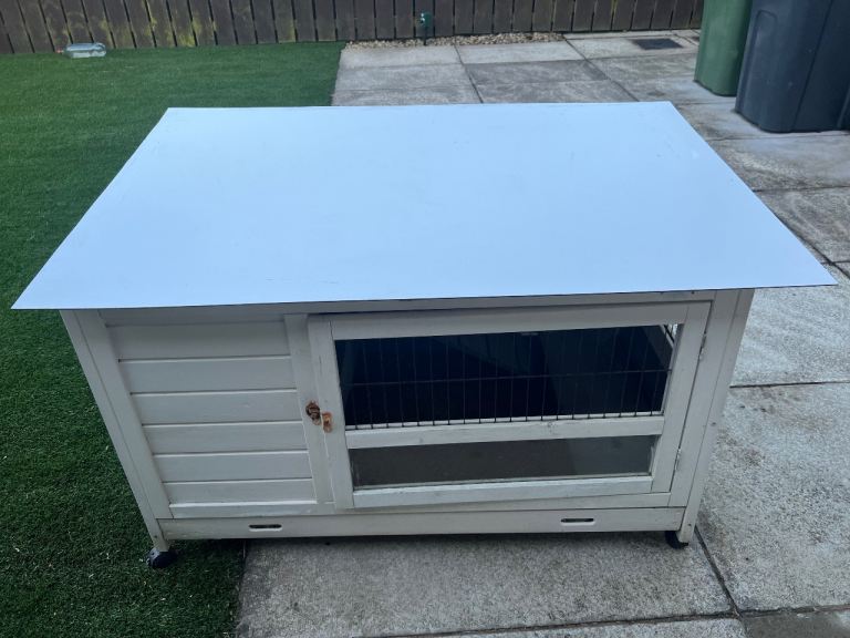 Wooden rabbit or guinea pig hutch with ramp