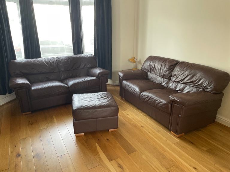 FREE TO COLLECT. 2 x 2-Seater brown leather sofas & footstool 