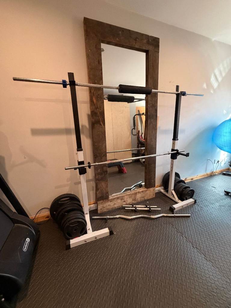 Squat Rack with weight set and multiple bars