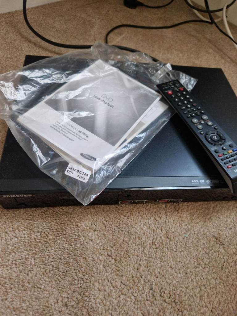 Samsung DVD Player with Remote and Manuals