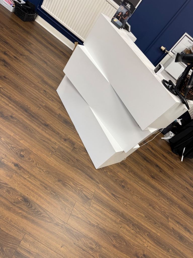 White metal reception desk