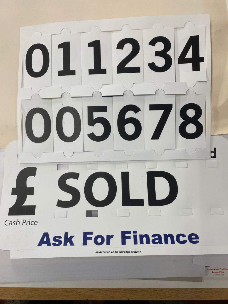 Vehicle price boards. 