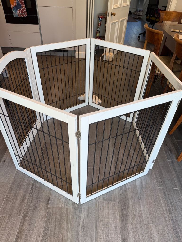 White wooden puppy play pen