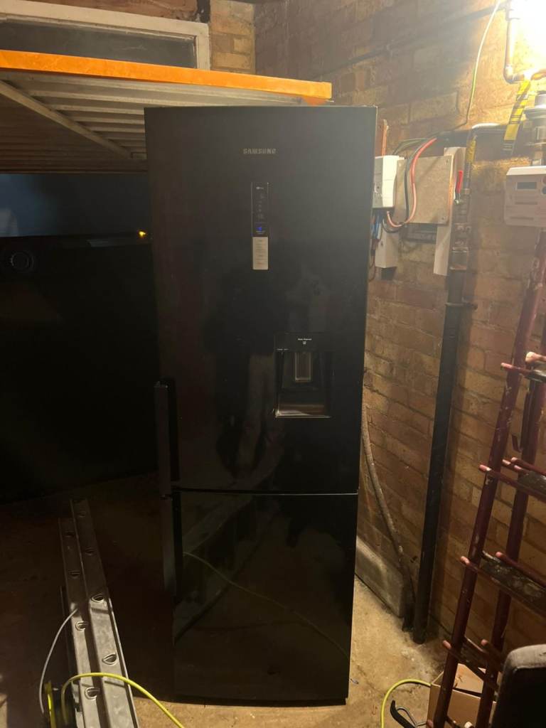 Black tall fridge freezer with water dispenser _fully working 