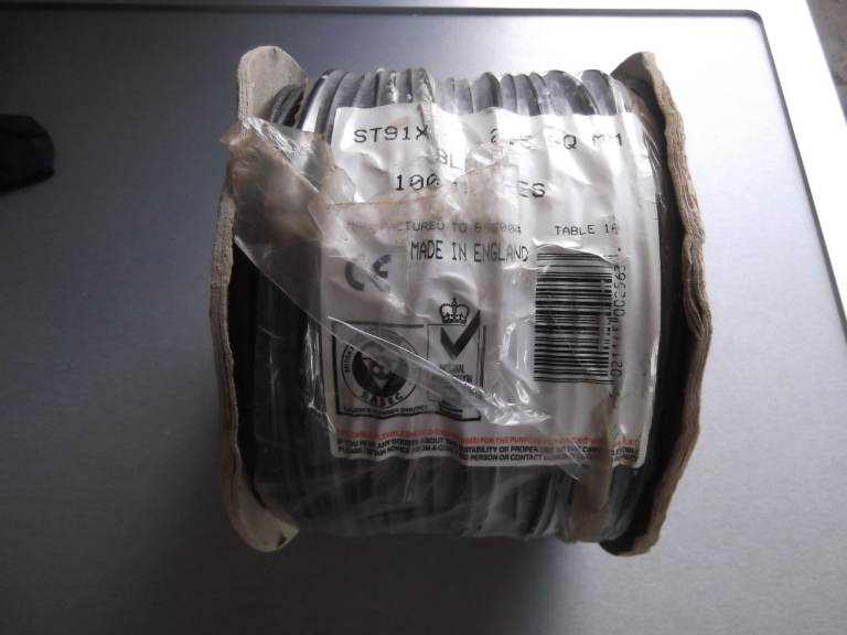 Unopened 100 metre reel of 2.5 sq.mm ST91X single core stranded black conduit cable - mfd. to BS6004