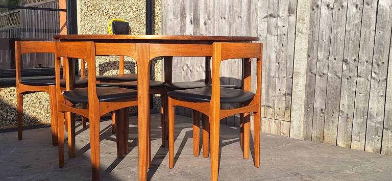 Vintage Nathan Teak table with 6 tuck in chairs. Mid century restored