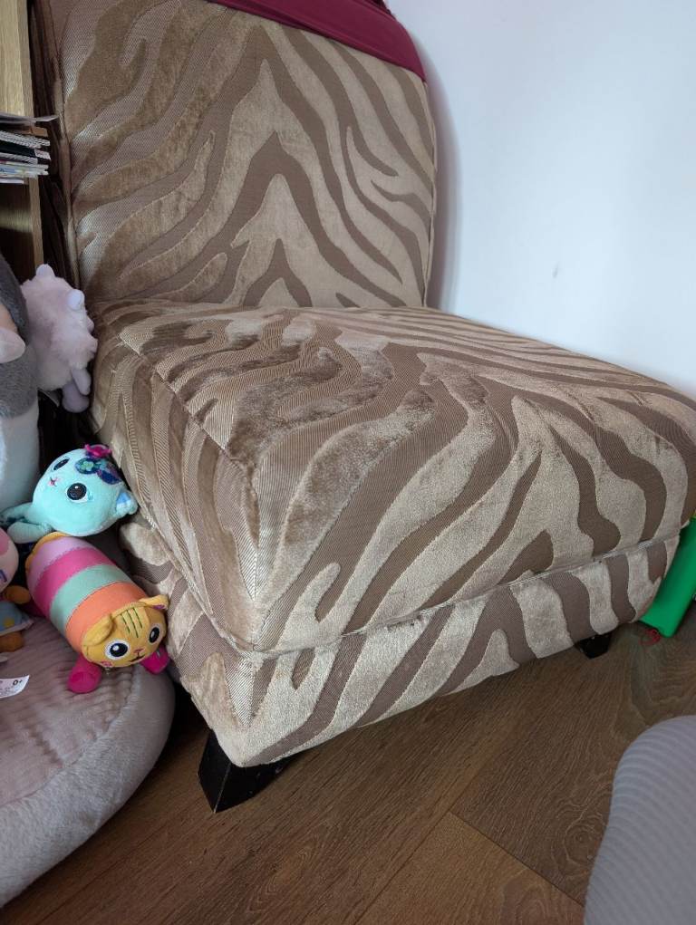Beige chair, zebra patterned fabric 