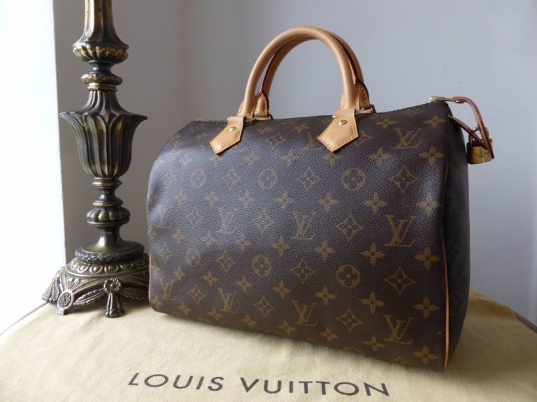 NEW Classic Louis Vuitton Speedy 30 handbag in the iconic brown monogram canvas.