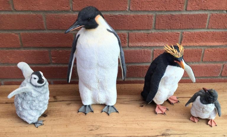Two large pairs of mother & chicks Penguin’s by Country Artists - boxed 