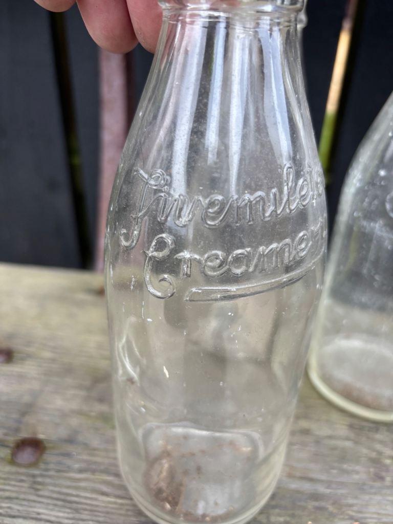 9 old glass milk bottles 