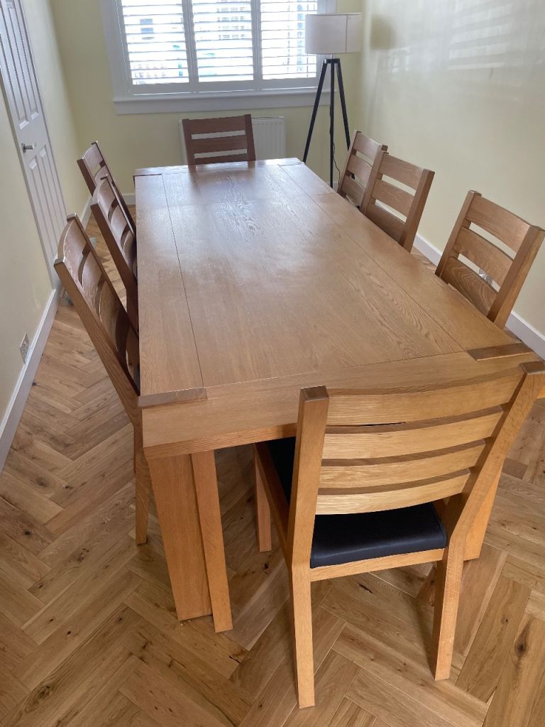 Extendable Oak Dining Table with 8 Faux Leather/Oak Chairs