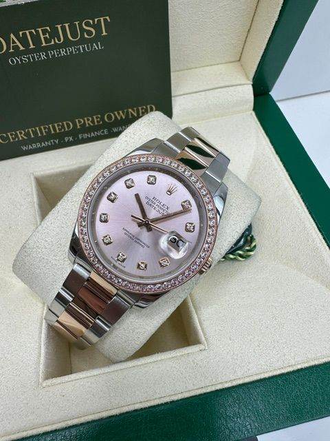 ROLEX 36MM ROSE AND STEEL , BOX AND PAPERS