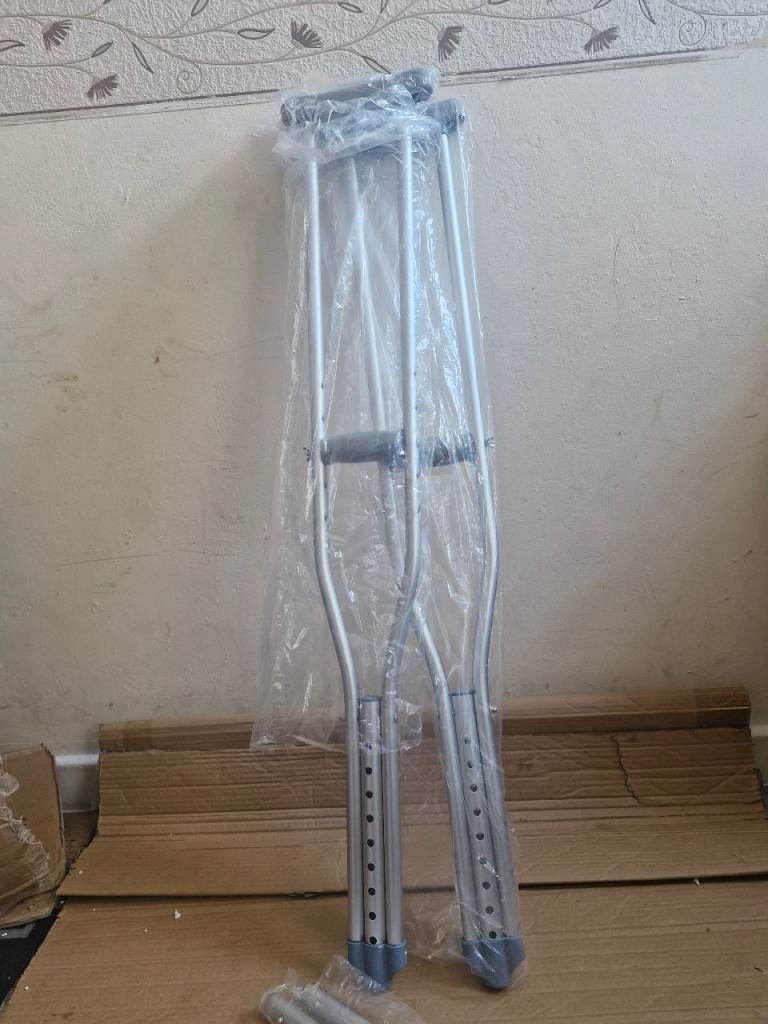 New Pair of Adjustable Silver Crutches