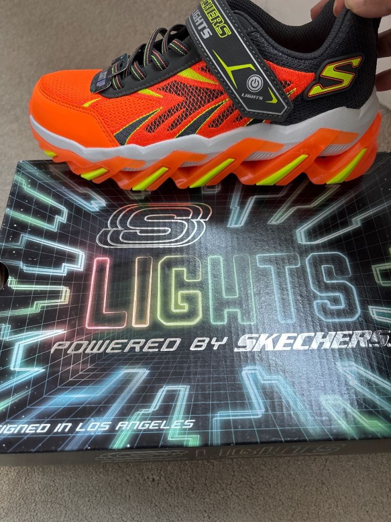 Brand new, Light up kids Skechers trainers, easy access Velcro fastening, in box. 