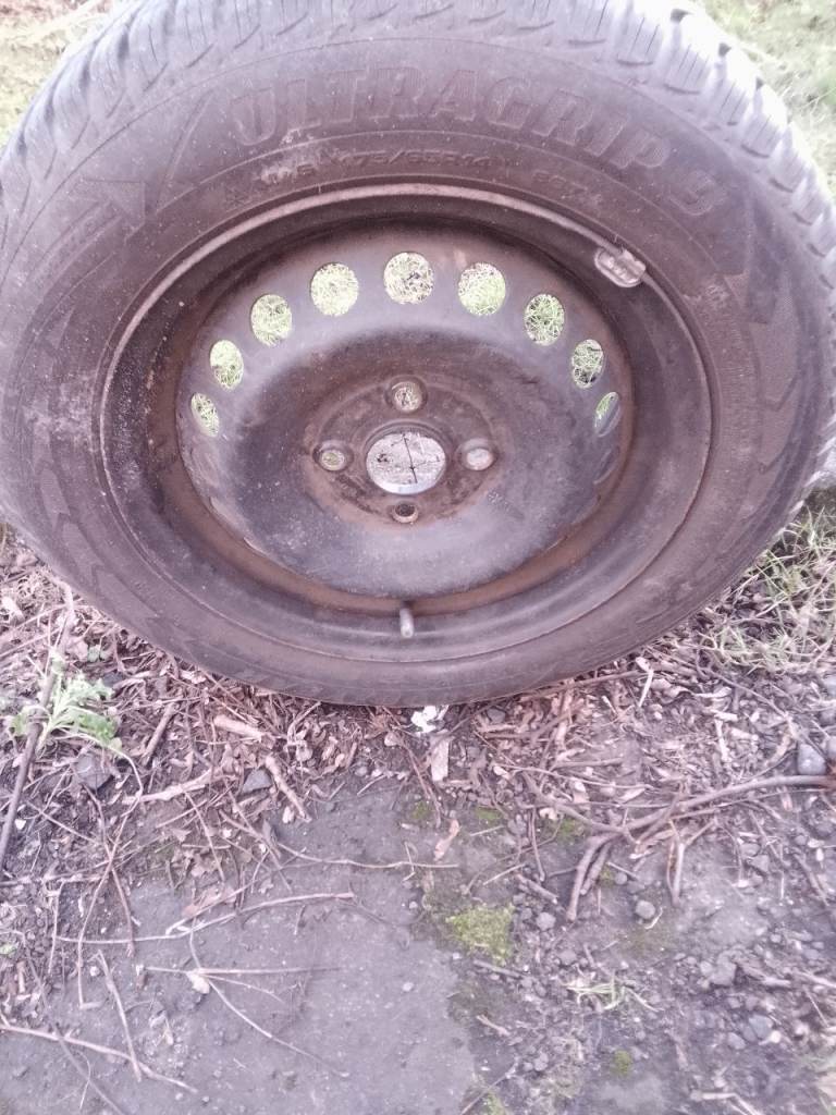 A 175/65/14 Goodyear ultra grip tyre with wheel 