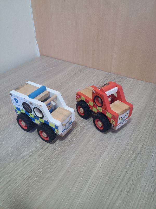 Wooden fire and police trucks
