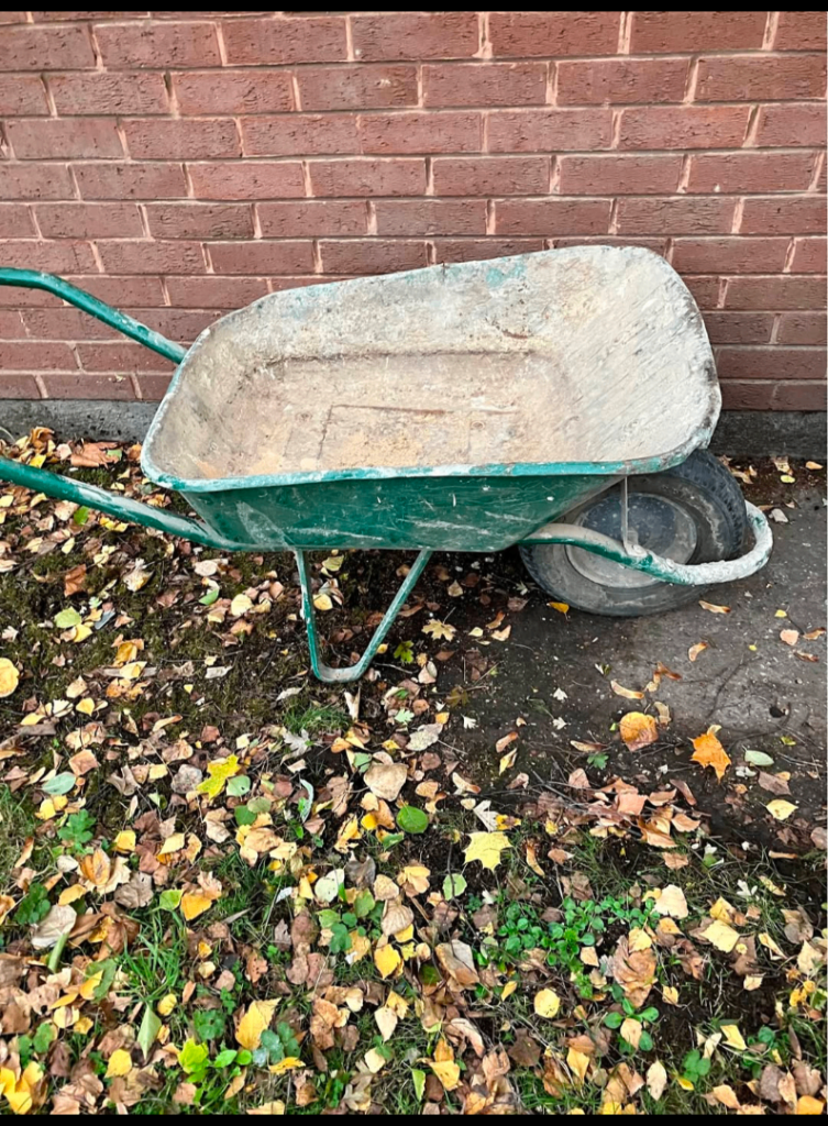 Green Wheelbarrow – Fair Condition, Ready for Work