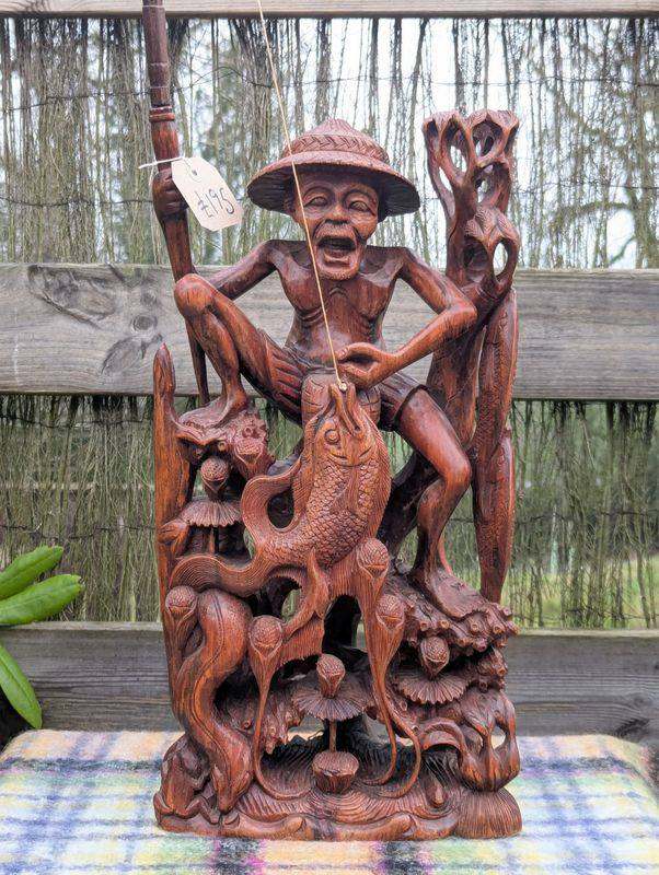 Balinese carved wooden statue of a fisherman
