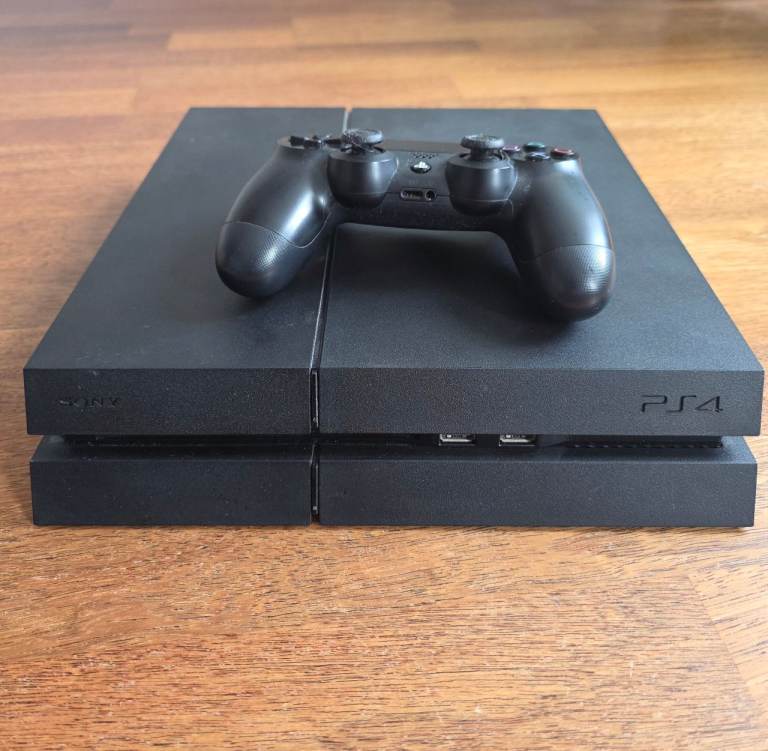 Sony PlayStation 4 Console with Controller and 8 Games