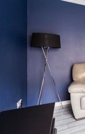 Silver floor lamp with black shade