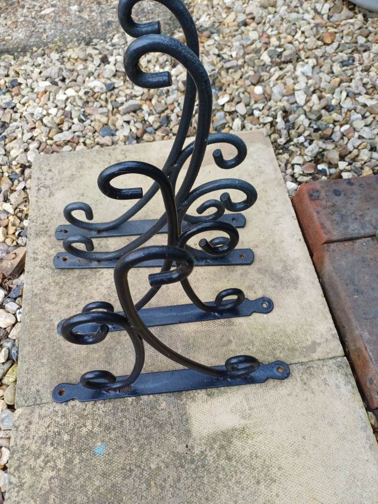 Ornate hanging basket brackets 