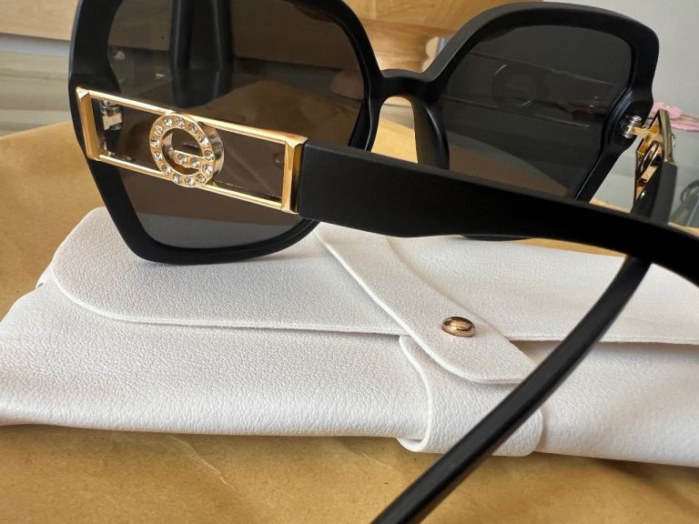 Stylish Black Sunglasses with Gold Detail  £10 each – As Good As New