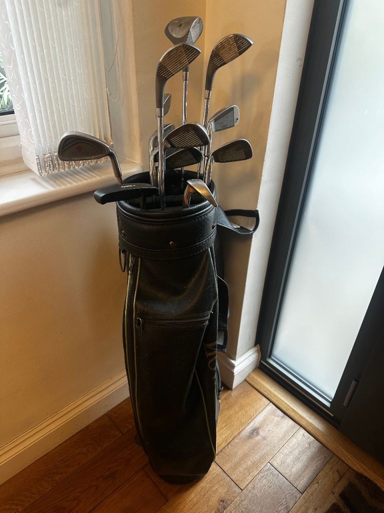 Full set of Regal golf clubs, including irons, woods, putter, bag, balls and tees