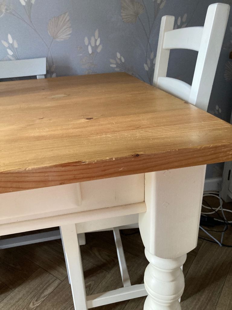  solid table with drawers and four chairs , cream legs /base -edging  
