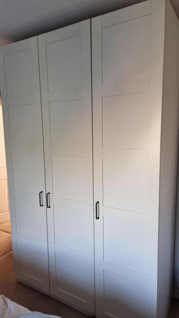 Large White Wardrobe with Shelves and Hanging Rail and four wire baskets 