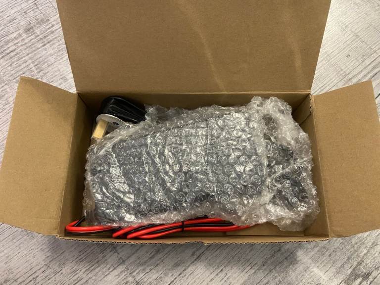 NEW in box. 24v 5amp mobility scooter/ electric wheelchair charger.