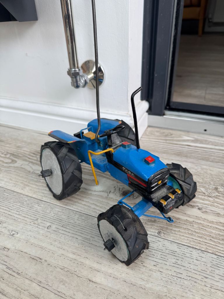 Vintage handmade steerable tractor toy