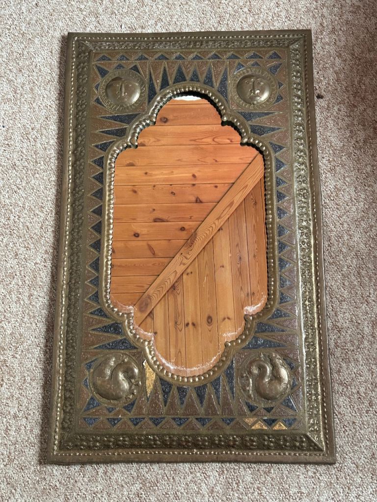 Mirror with brass frame