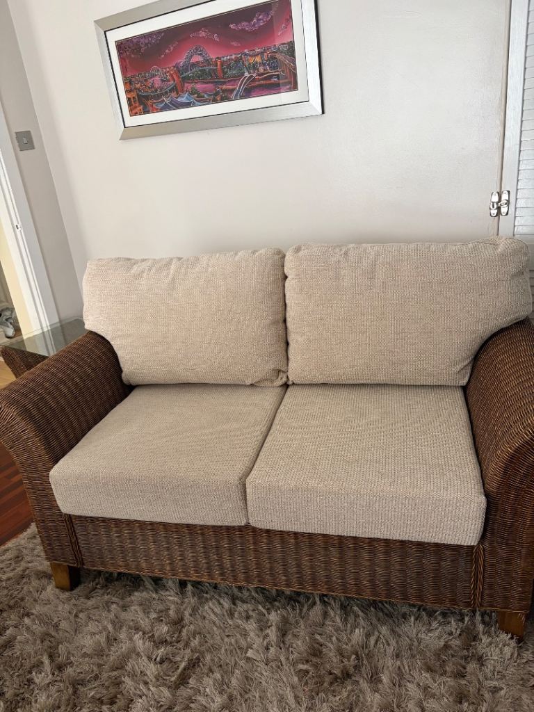 Two-Seater Rattan Sofa with Cream Cushions – Excellent Condition