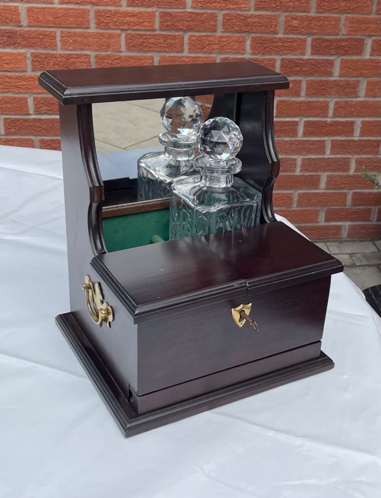 Decanter and glass holder.