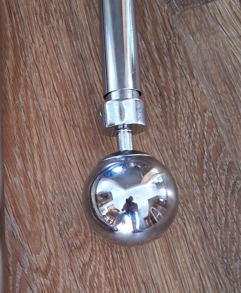 Extending polished silver Curtain Poles with Finials  