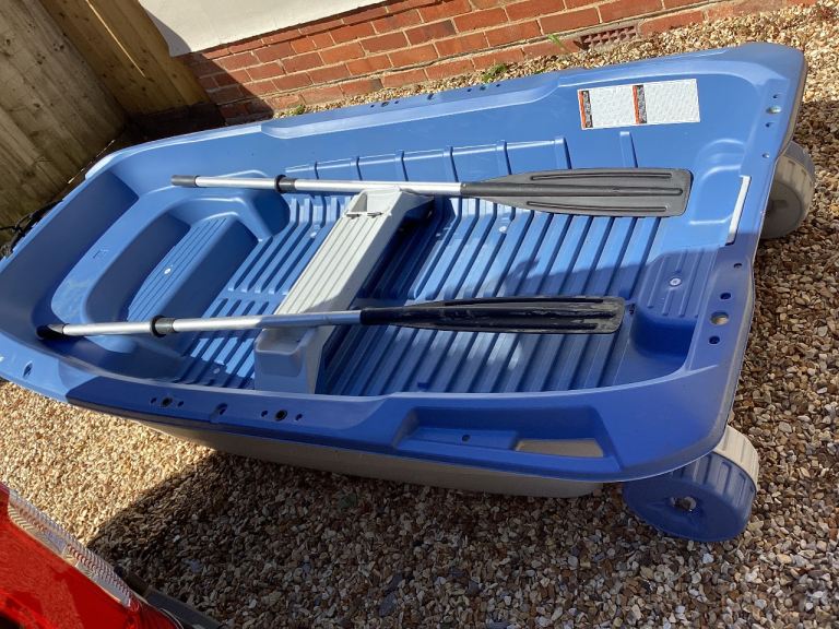 Small Blue Dinghy with Oars – 