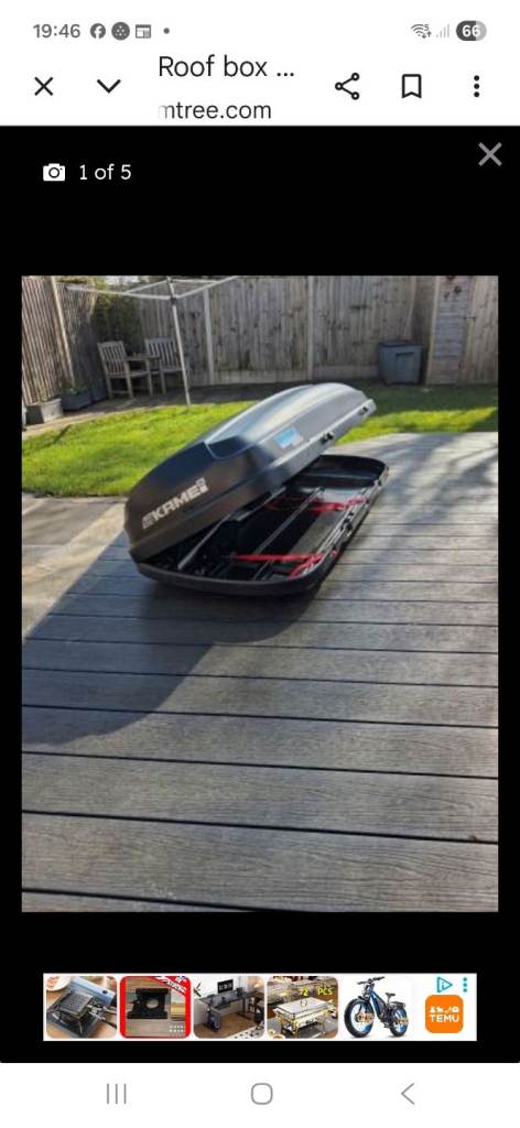 Black roof box with universal bars