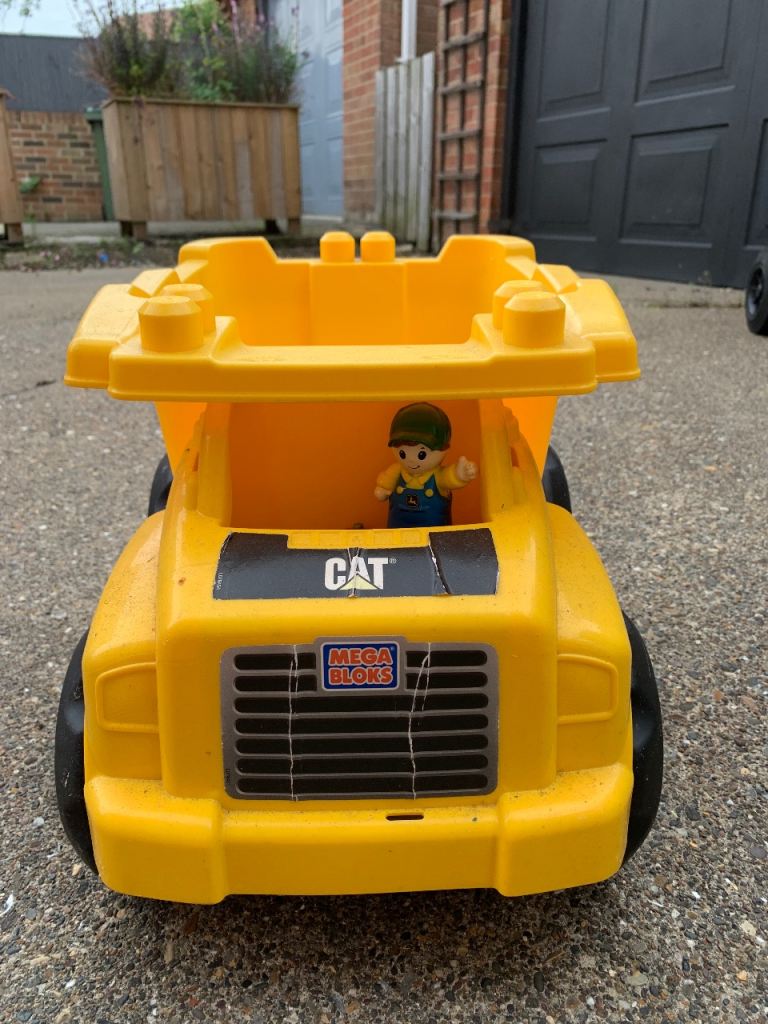 Mega Bloks CAT Dump Truck Toy with Figure – Good Condition