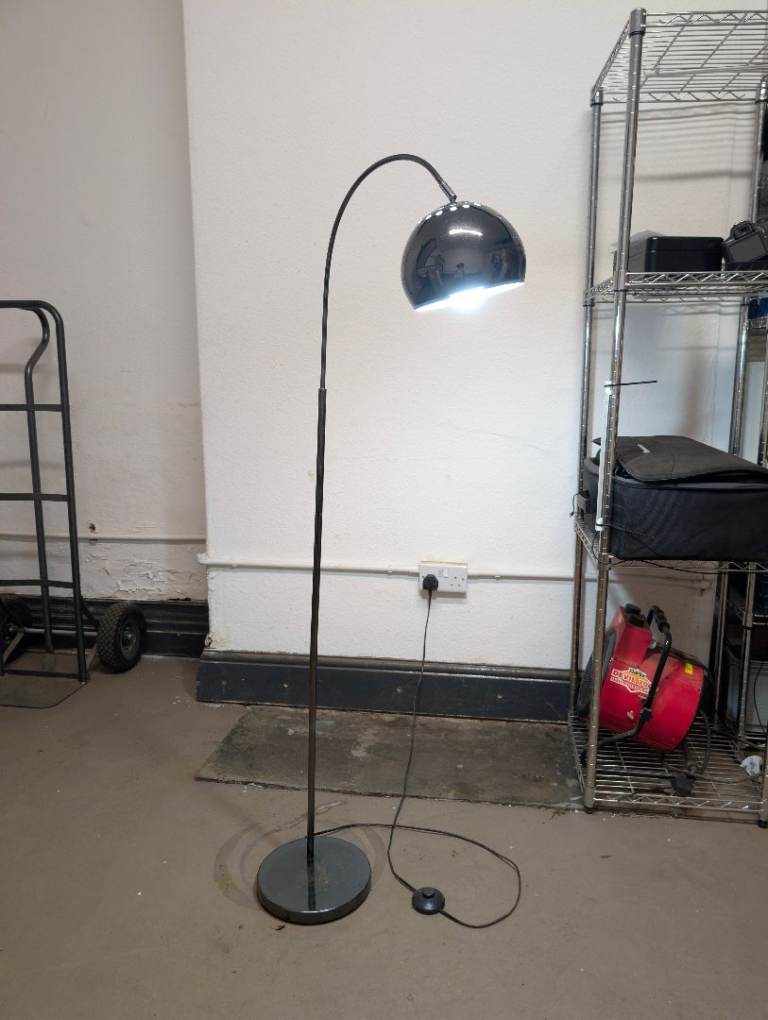 Tall curved metal floor lamp 